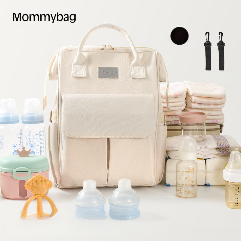 Suur emmekott piiriülene uus suure mahutavusega kaasaskantav seljakott beebitarvete hoiustamiseks, mida saab riputada jalutuskäru ema- ja beebikoti külge