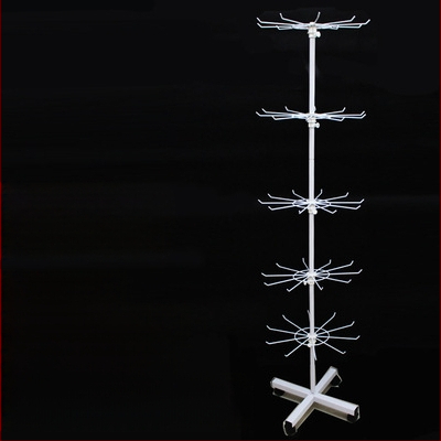 Daugiasluoksnė gatvės prekystalio besisukanti lentynėlė, karoliai, automobiliams pakabinami karoliukai, virvelės, kojinės, skrybėlių papuošalų lentynėlė, parduotuvės durų pakabinamas stovas, vitrina 1