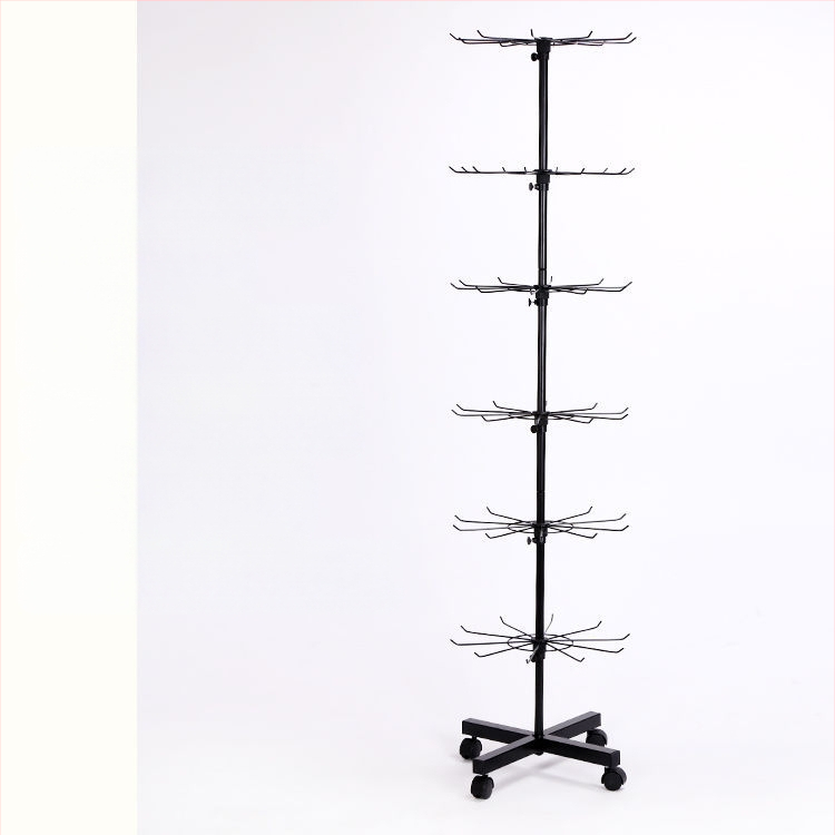 Daugiasluoksnė gatvės prekystalio besisukanti lentynėlė, karoliai, automobiliams pakabinami karoliukai, virvelės, kojinės, skrybėlių papuošalų lentynėlė, parduotuvės durų pakabinamas stovas, vitrina 1