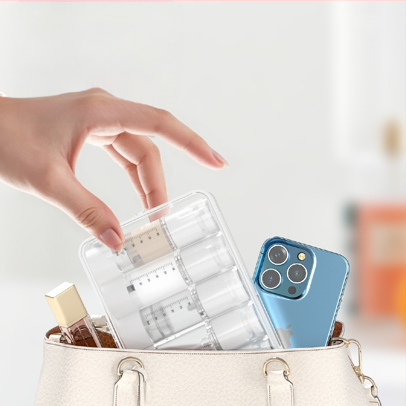 Vakuuma pudeļu pildīšanas pārnēsājamā smidzināšanas pudele emulsijas presei, caurspīdīga ceļošana ar mēroga kosmētikas pudeļu pildīšanas uzvalku