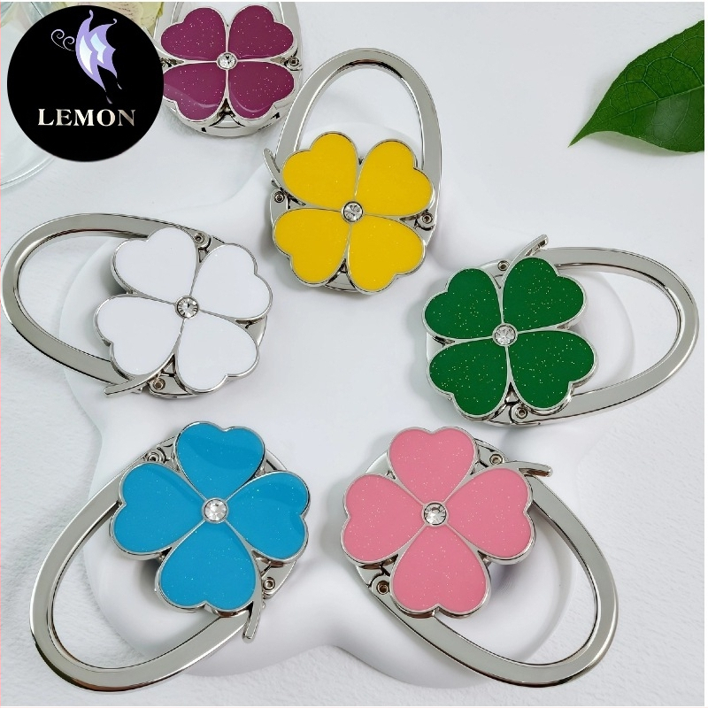 E-kaubanduse eksport Uute vidinate värvitud õlivärviga neljaleheline ristik ristik ümmargune brändi käekott konksuga käekoti rippuv