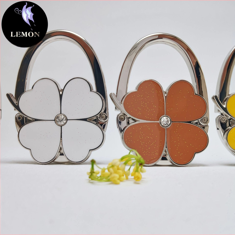 E-kaubanduse eksport Uute vidinate värvitud õlivärviga neljaleheline ristik ristik ümmargune brändi käekoti konksuga kott rippuv käekott