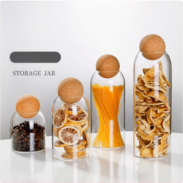 Stiklo laikymo indas su kamštiniu dangteliu, apvalios formos, iš borosilikatinio stiklo, teai ir kavos pupelėms