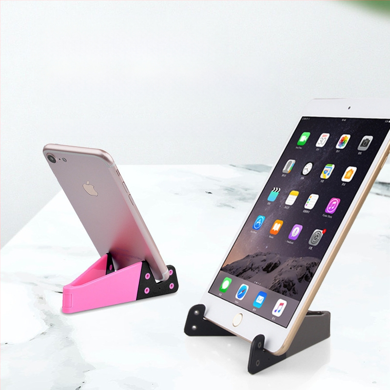 V-veida galda statīvs telefoniem un planšetēm, no plastmasas, universāls, ar personalizācijas atbalstu