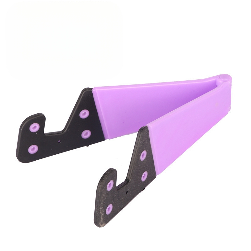 V-veida galda statīvs telefoniem un planšetēm, no plastmasas, universāls, ar personalizācijas atbalstu