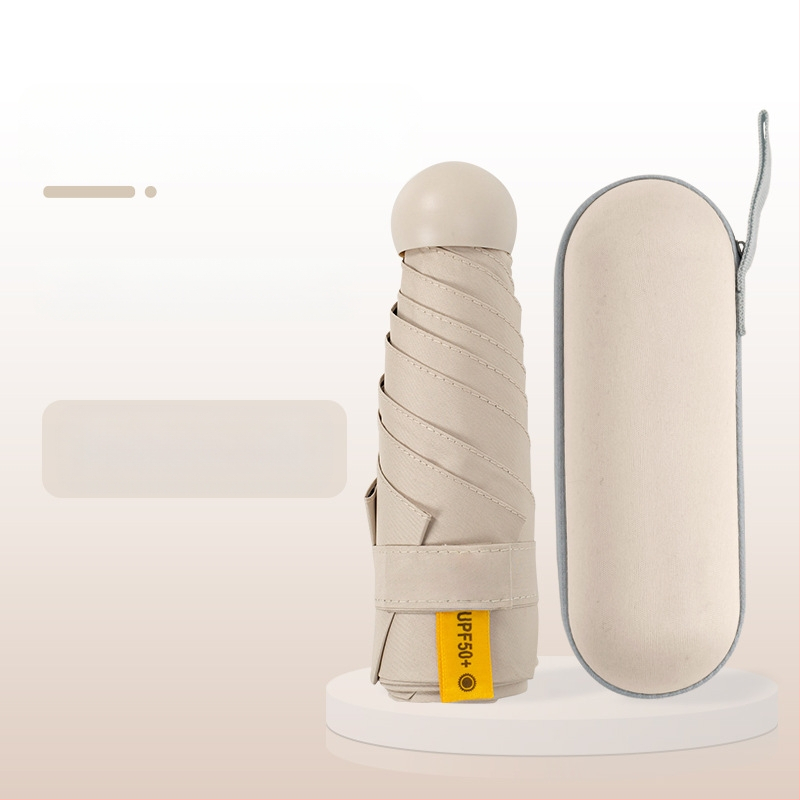 Kapsulinio tipo skėtis moterims, 6 rėmų, 210T audinys, UPF >40, rankinis atidarymas‑uždarymas, svoris 220 g