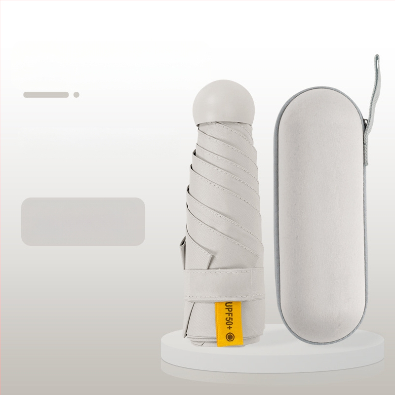 Kapsulinio tipo skėtis moterims, 6 rėmų, 210T audinys, UPF >40, rankinis atidarymas‑uždarymas, svoris 220 g