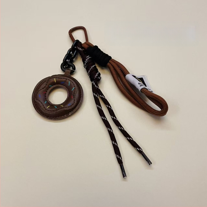 Donut formos rankinės pakabukas su vaisių raštu, nailoninis pakabukas rankinėms, stilius: nacionalinė tendencija ir naujasis stilius (Nailonas; Vaisių raštas; Stilius: Nacionalinė tendencija ir Naujas stilius; Sezonas: Žiema 2024)