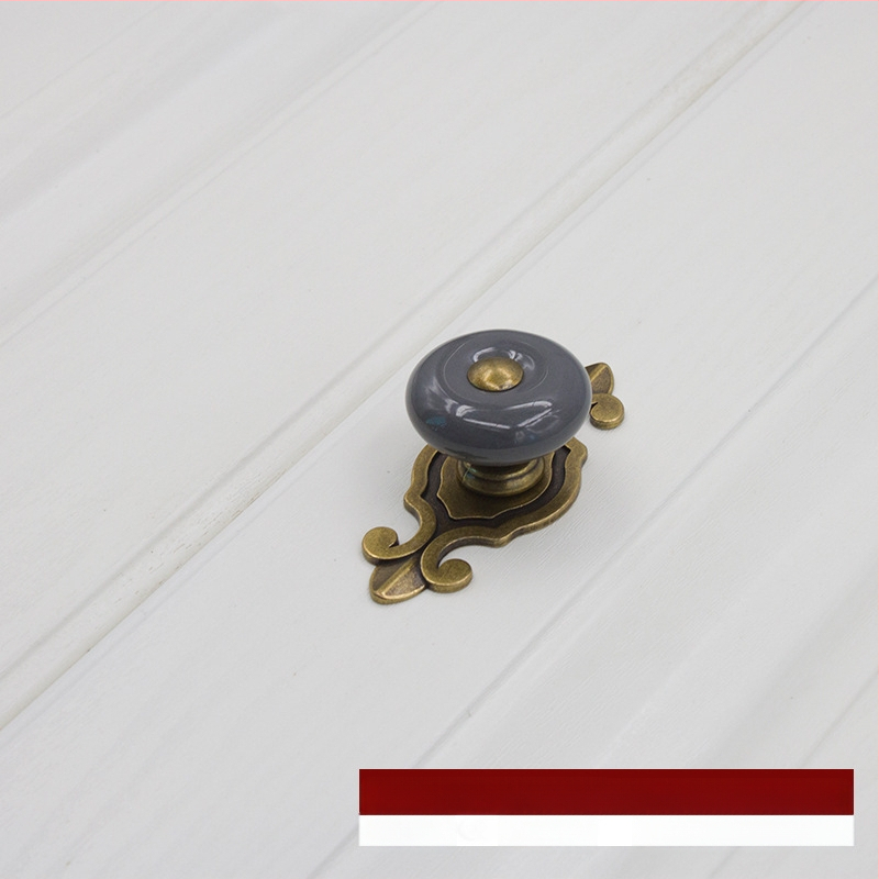 Apvali keramikinė spintos durų ir stalčiaus rankenėlė su baze, šiuolaikinis minimalistinis stilius.