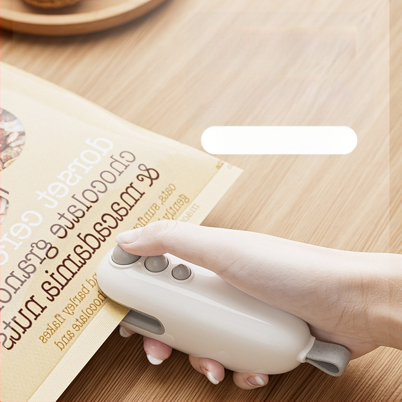 Mini uždarymo mašina užkandžiams, nešiojama namų uždarymo priemonė, dviejų funkcijų uždarymo ir pjaustymo įrankis plastikiniams maišeliams, modernus paprastas dizainas