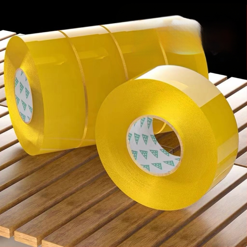 Yixin uždarymo juosta - skaidri, aukštos klampumo, platus pakavimo juostelė; Ilgis 2000 cm, Plotis 4.38 cm, Storis 3 cm