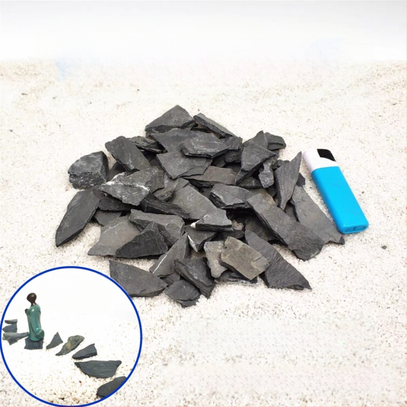 Bruņurupuču terārijs: sauļošanās platforma no akmens plāksnēm, dekoratīvie akmeņi