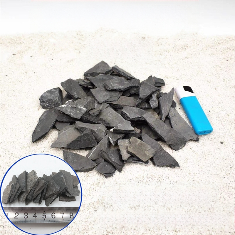 Bruņurupuču terārijs: sauļošanās platforma no akmens plāksnēm, dekoratīvie akmeņi