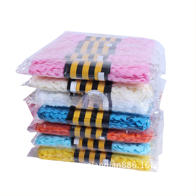 Poliesterio nėrinių juostelė drabužiams, S-formos vandens bangų raštas, įlenktas kraštas, Jumbo ženklas