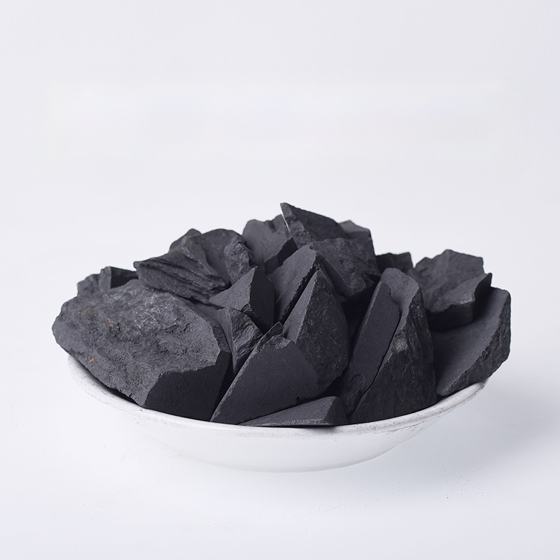 Shungito kristalų grubus akmuo – kartoninis įpakavimas; grynoji masė nuo 100 g; tinkamas įmonių dovanoms