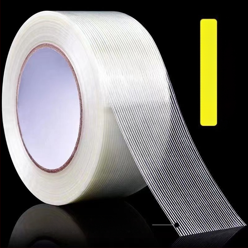 Stikla šķiedras lente – augsta viskozitāte, režģveida raksts, substrāts: šķiedra, līmēšanas sistēma: karstās kausēšana, biezums 0,14 mm, viskozitāte 600 N/m