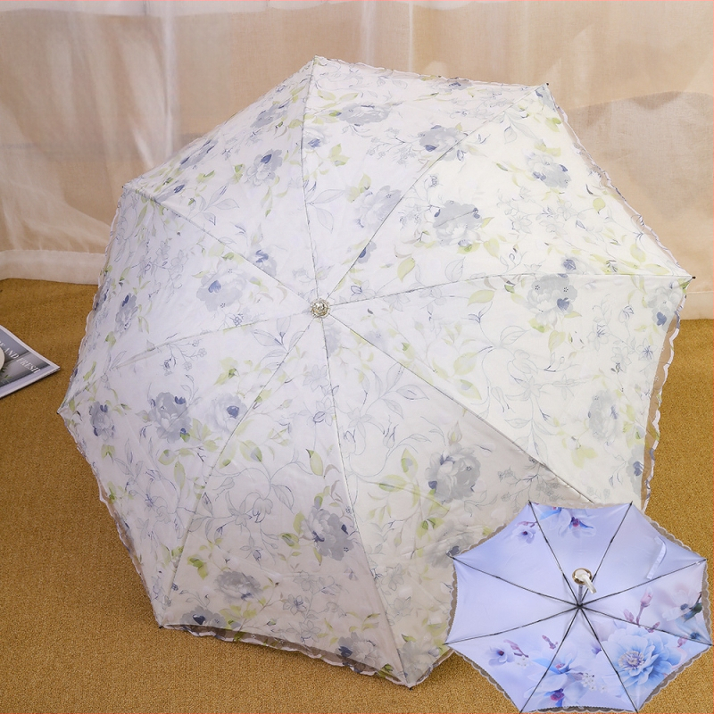 Mežģīņu audums, dubultslāņu lietussargs, 8 stieņu dzelzs rāmis, manuāla atvēršana, silikona rokturis, UV PA++ aizsardzība