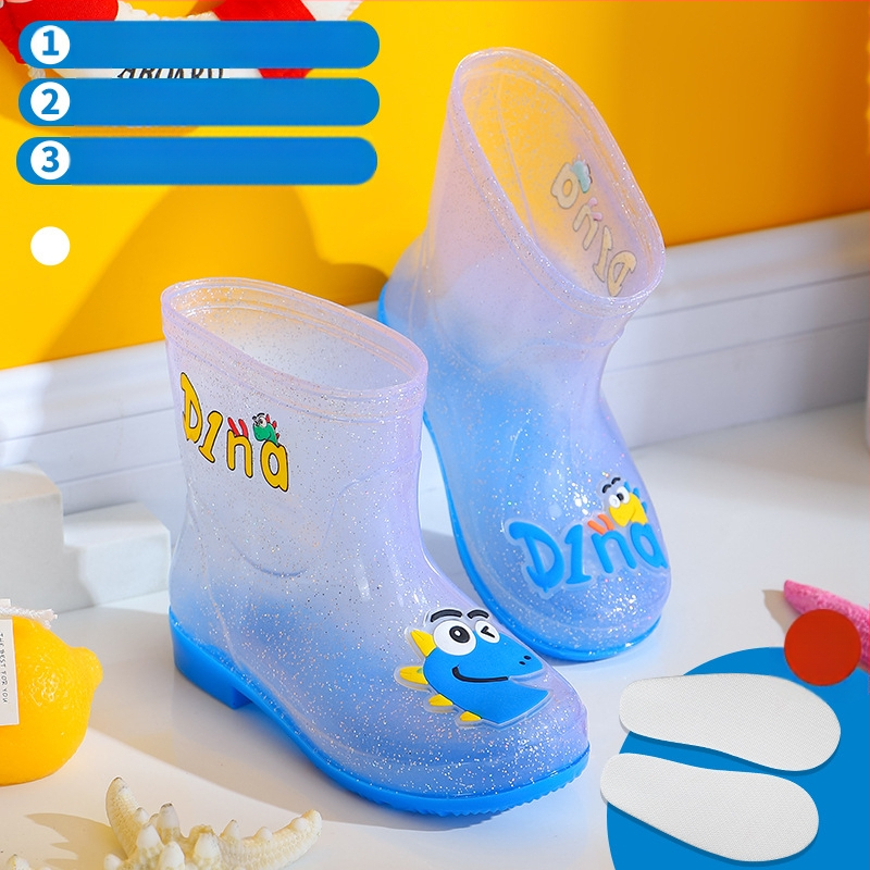 Bērnu lietuss zābaki - PVC augšdaļa, vidējā caurules augstums, zems papēdis 1–3 cm, burti-dinozaura raksts, animācijas stils