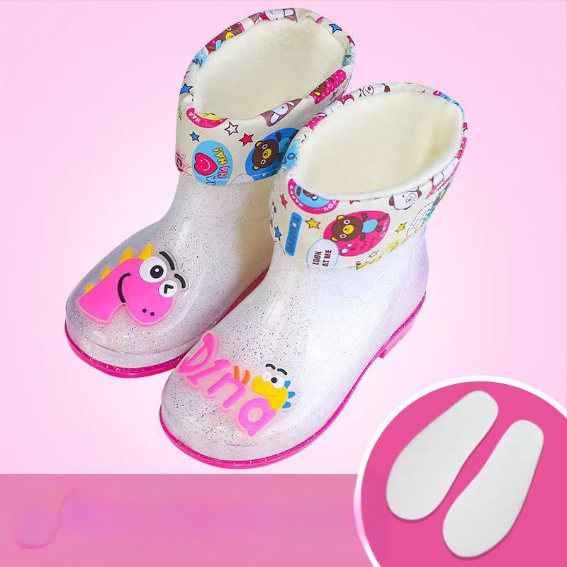 Bērnu lietuss zābaki - PVC augšdaļa, vidējā caurules augstums, zems papēdis 1–3 cm, burti-dinozaura raksts, animācijas stils