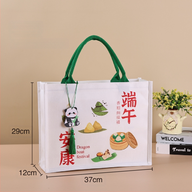 Dovanų įpakavimo krepšys su laminuota drobe; aplinkai draugiškas poliesterio ir medvilnės mišinys; logotipo spauda prieinama; spausdinimo metodai: serigrafinė spausda, mašininė spausda, skaitmeninė spausda, šilumos pernešimas