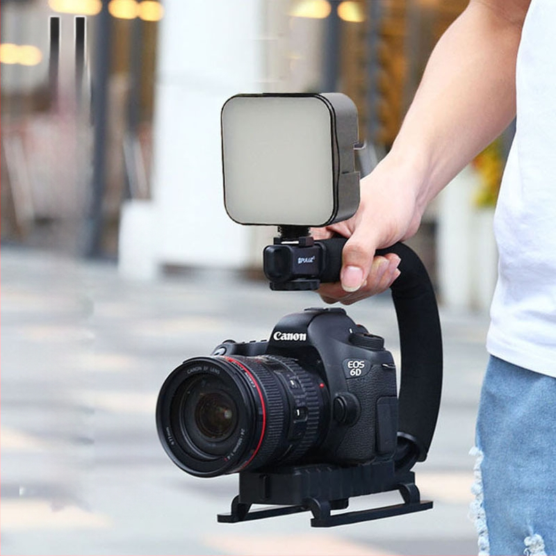 U formos nešiojamas vaizdo stabilizatorius su LED apšvietimu mobiliems telefonams; 2W LED, 6500K, 3V maitinimas, ryškumo reguliavimas