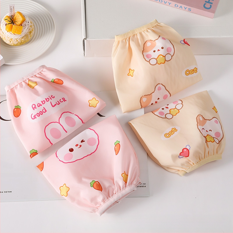 Manșete impermeabile cu imprimeu desen animat pentru copii – pentru bucătărie, lavabile, rezistente la pete, 3–13 ani.