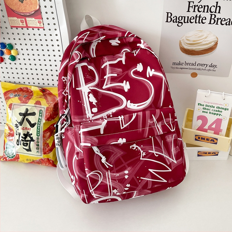 Lányok iskolai hátizsák – ultrakönnyű, nagy kapacitású, nylonból, légpárnás vállpántokkal, poliészter bélés, betűmintás dizájn, iskola használatra