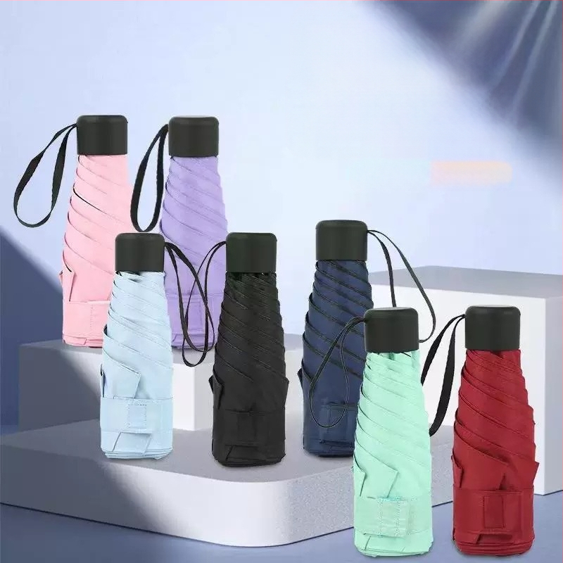 Компактен капсулен чадър, 6 ребра, ръчно отваряне, UPF > 50, плат 210T, железен прът