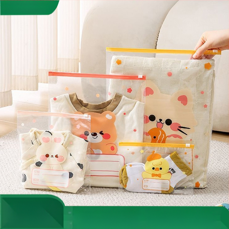 Drēbju uzglabāšanas soma, kubiska PE kārba ar saldu karikatūru dizainu, caurspīdīgs rāvējslēdzējs, putekļu izturīga un noslēgta, daudzfunkcionāla lietošanai apģērbam, kosmētikai un personīgajām higiēnas precēm