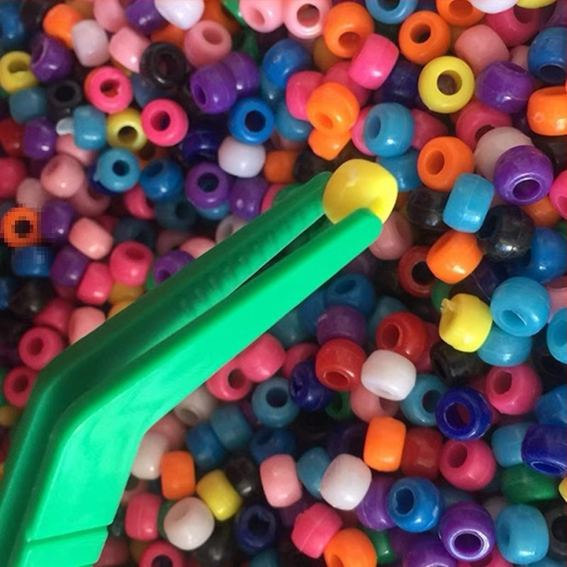 Montessori ugdymo žaislas: metalinės žnyplės smulkiajai motorikai, moksliniams stebėjimams (Kilmė: Pekinas; Amžius: 0-2 metai)