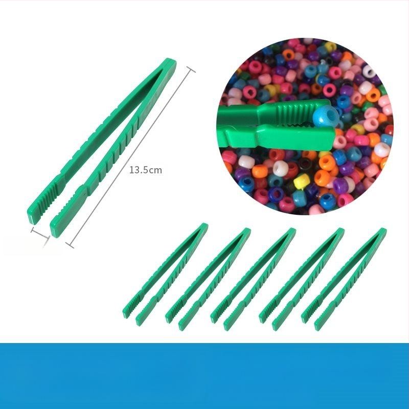 Montessori ugdymo žaislas: metalinės žnyplės smulkiajai motorikai, moksliniams stebėjimams (Kilmė: Pekinas; Amžius: 0-2 metai)