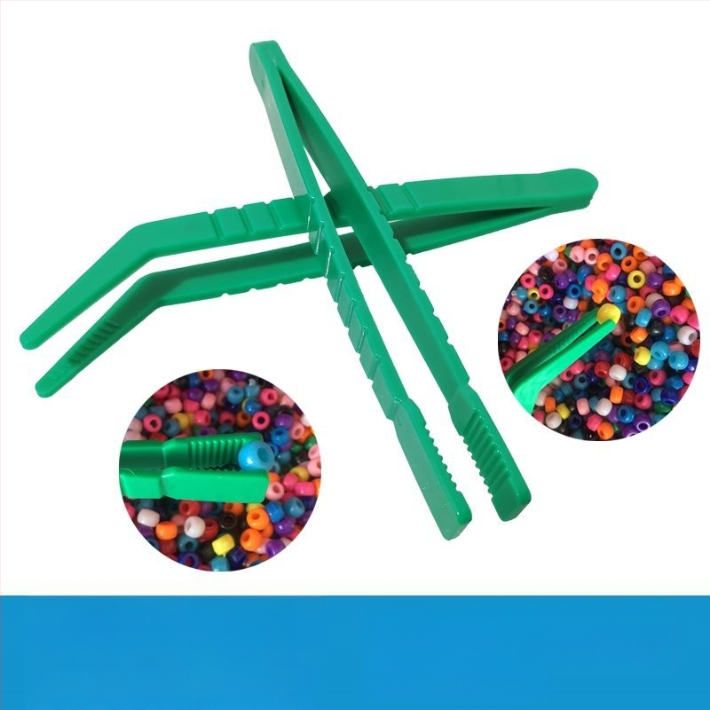 Montessori ugdymo žaislas: metalinės žnyplės smulkiajai motorikai, moksliniams stebėjimams (Kilmė: Pekinas; Amžius: 0-2 metai)