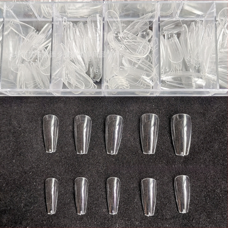 Διάφανα τεχνητά νύχια για κόλλημα, χωρίς λιμάρισμα και ίχνη, κουτί 500 τεμάχια; Σχήματα: τραπεζοειδή, σταγόna νερού και τετράγωνα; περιλαμβάνονται αυτοκόλλητα νυχιών.