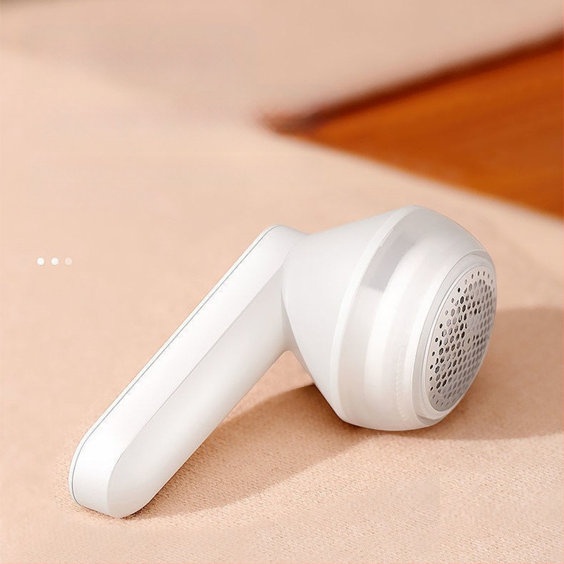 Audumu pūku noņemšanas ierīce – plastmasas korpuss, modelis 719, uzsākts 2024. gadā, pūku ritinājs un matu noņemšana