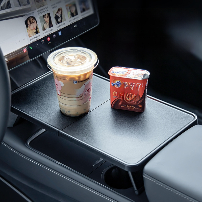 Plastmasas automobiļa ēdienu paliktnis Tesla Model Y3 ar salokāmu dizainu, snap-in uzstādīšanu un svaru 0,25 kg.