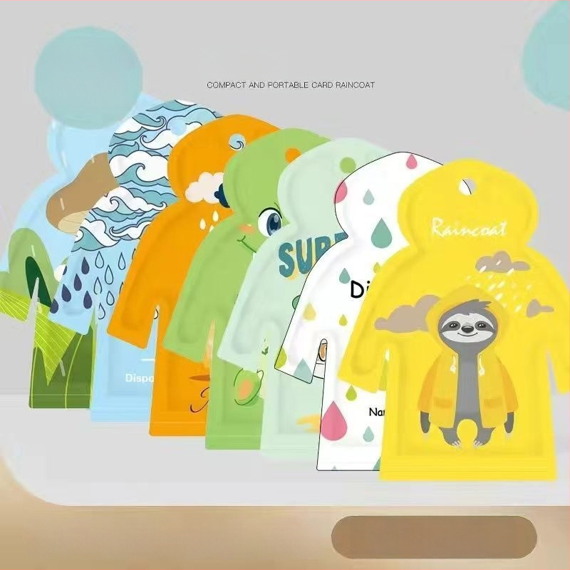Pončo do dažďa v tvare karty pre dospelých aj deti, kreslený štýl, PE látka 0,03 mm, vodotesná vrstva PE lepidla, prenášateľný vreckový dizajn