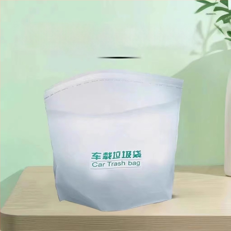 Samo stojaci automobilový odpadkový kôš s lepiacim uchytením na palubnú dosku, vodotesný plastový valec na jednorazové vrecká