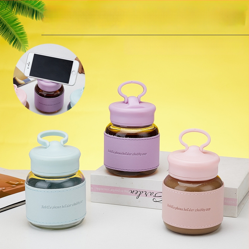 Sklenený pohár zo soda-lime s uzáverom a držiakom na telefón, kruhový, jednovrstvový, netečúci a teplotne odolný, tlač loga možná