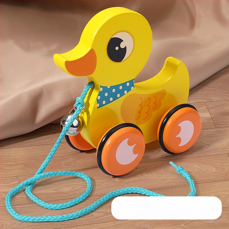 Drevená ťahacia chodítko hračka pre deti 4–6 rokov s motívom kresleného zvieraťa; materiál: drevo; značka: Big hand in small hand; rozvíja koordináciu ruka-oko