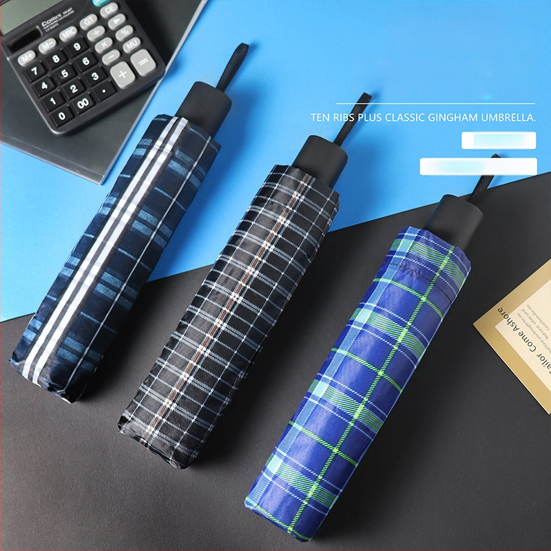 Trīsdēļu lietussargs diviem pieaugušajiem, poliestera audums, 10 tērauda ribas, tērauda stabs un rokturis, mehānisks atvērums, pretvējš, logotipa drukāšana un pielāgošana pieejama