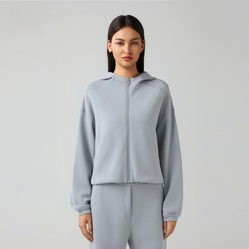 Női kapucnis cipzáros pulóver, lazán szabott, futáshoz és edzéshez, őszi-téli szezon; pamutkeverék anyag 52% poliészter; belső bélés pamut.
