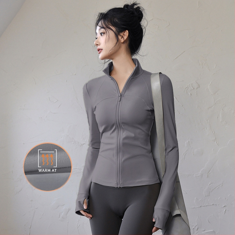 Ženski top za jogu i fitness – uski kroj, dugi rukavi, brzo sušeći materijal; tkanina: mješavina kemijskih vlakana, sastav tkanine: 82,5% poliester; podstava: Spandex, sadržaj podstave: poliester