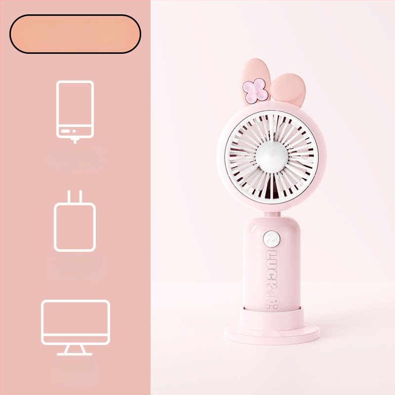 Rokas karikatūras dizaina pūtējs ar drukātu rokturi un karikatūras ausīm, uzlādējams, iebūvēta akumulatora kapacitāte 100-300 mAh, 5V, 5W, troksnis 36-45 dB, akumulatora darbības laiks 0-1 h