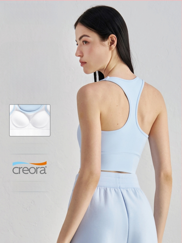 Joga sportinė liemenėlė su krūtinės pagalvėlė – 3/4 kupolas, vidutinio formos kaušelis, racerback su fiksuotomis dvigubomis petnešomis, audinys nailonas/elastanas