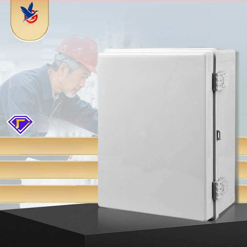 IP65 plastmasas ūdensizturīga sadales kārba ārējai lietošanai, korpuss ABS/PC, sienas montāža ar šarnīru aizslēgu, caurspīdīgs vāciņš