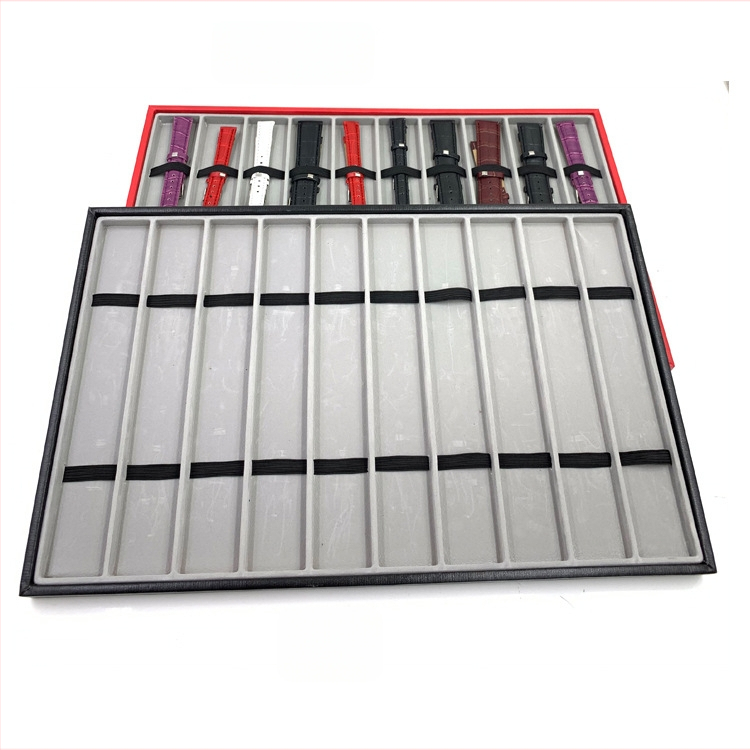 Pulksteņu displeja statīvs ar 10 nodalījumiem – pulksteņu uzglabāšana; materiāli: MDF, blister, PU āda, flanelis; tolerances 3–5 mm; juvelierizstrādājumu iepakojums