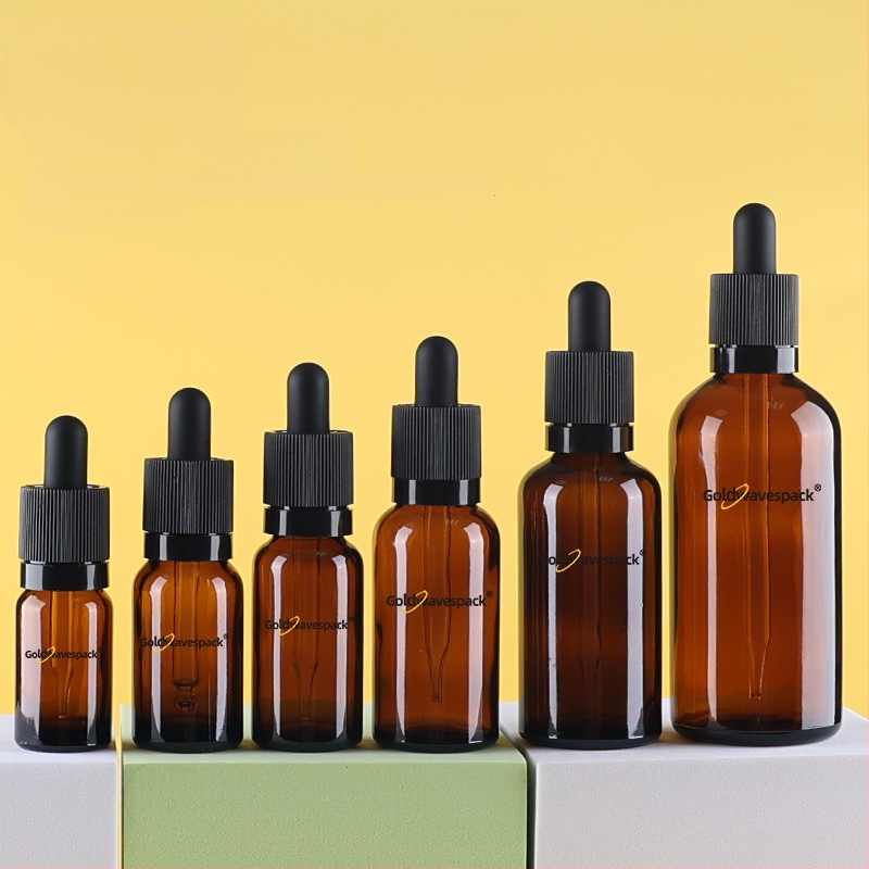 Pritaikytas stiklinis kosmetikos buteliukas su anti-vagystės lašintuvu, 18/410 kaklelis, spauda ir elektroplatinimas, skirta grožio pakuotei