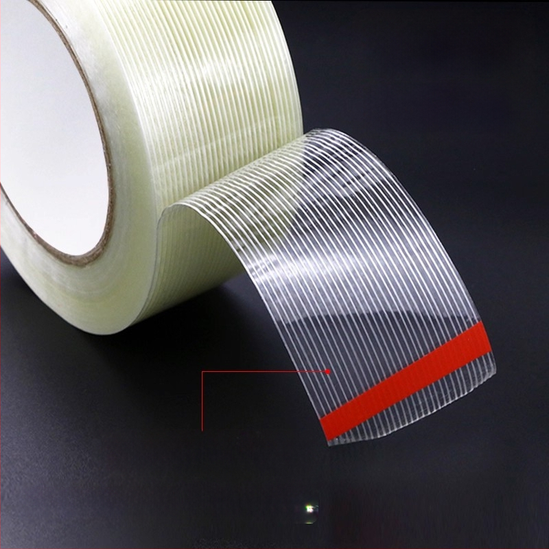 Stiklo pluošto juosta – Aukšta sukibimo jėga, izoliacija, temperatūros atsparumas (Plotis: 10–1020 mm; Ilgis: 50 m; Storis: 130 μm; Pagrindinė medžiaga: pluoštas; Klijavimo sistema: gumos klijai)