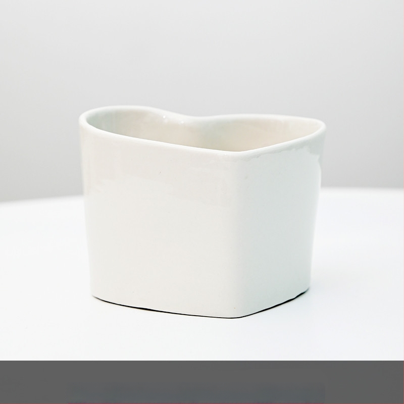 Keraamiline lillepott logotüübi trükiga; lihtne portselani disain; sobib laua- või põrandakasutuseks; poolmanuaalne tootmisprotsess.