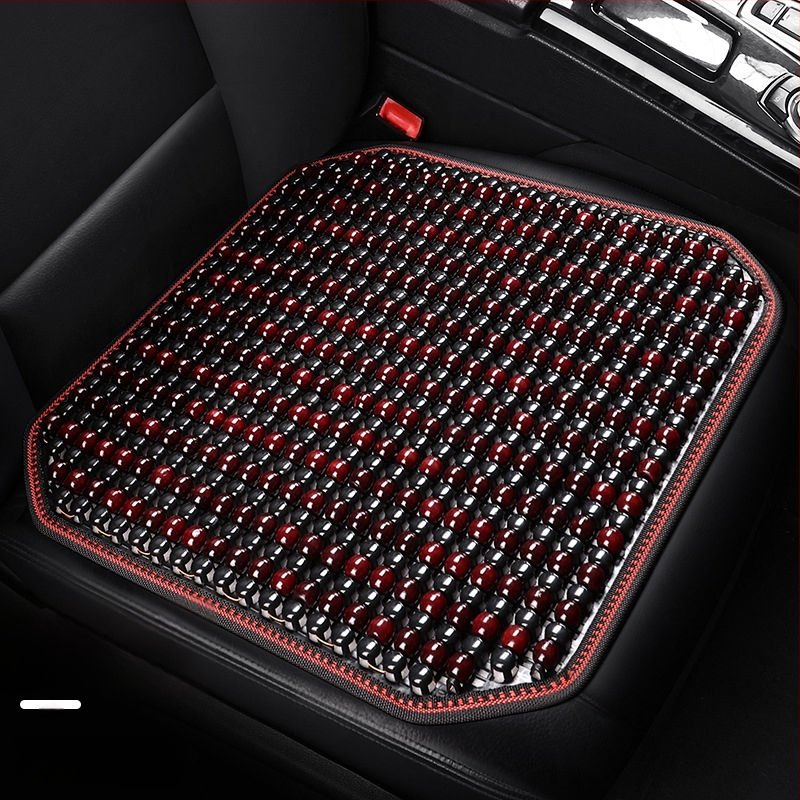 Automobiļa sēdekļa spilvens, viengabala kvadrātiska no koka lodītēm, aizmugures sēdeklim, elpojošs un pretslīdējošs.